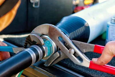 Pipe repair service using professional plumbing tools in Pensacola, Florida